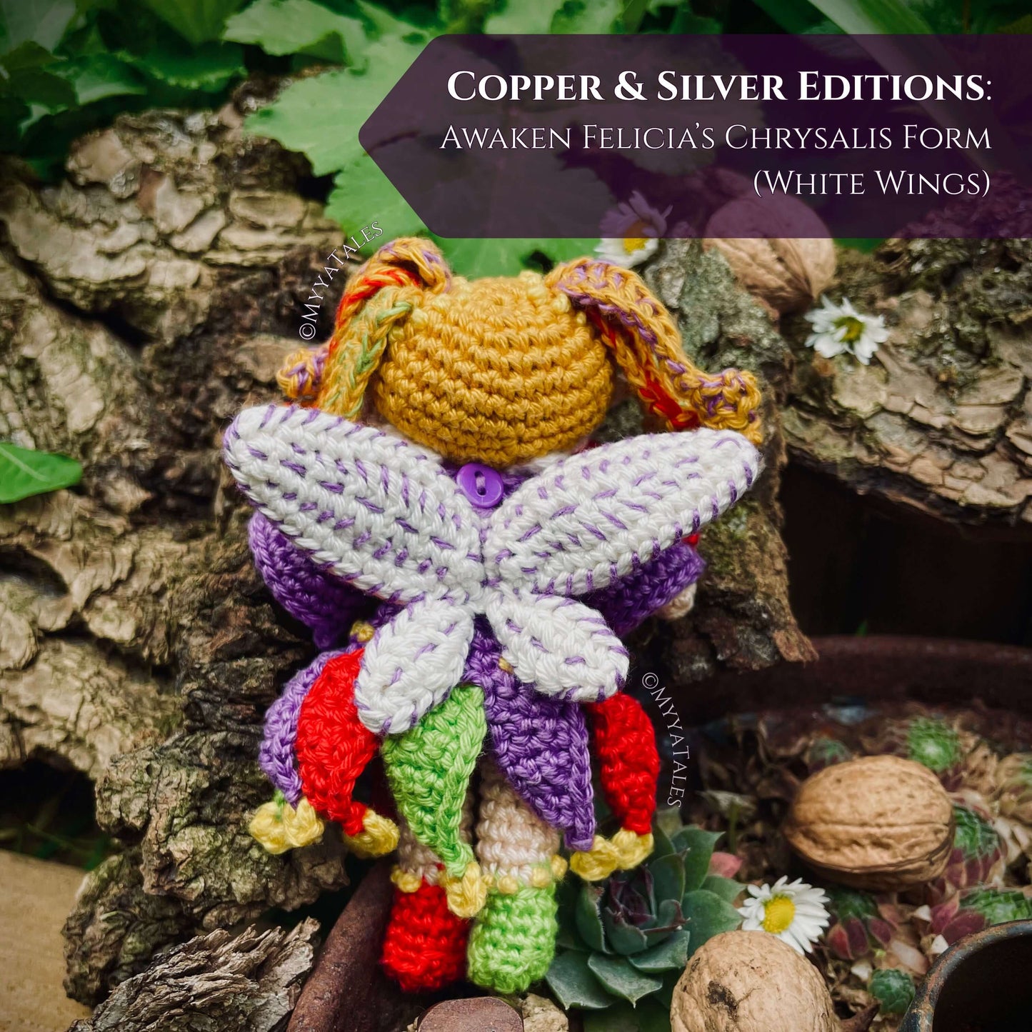 Back view of whimsical crochet fairy wings, Chrysalis form with white wings, Amigurumi wing attachment tutorial.